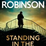 standing in the shadows